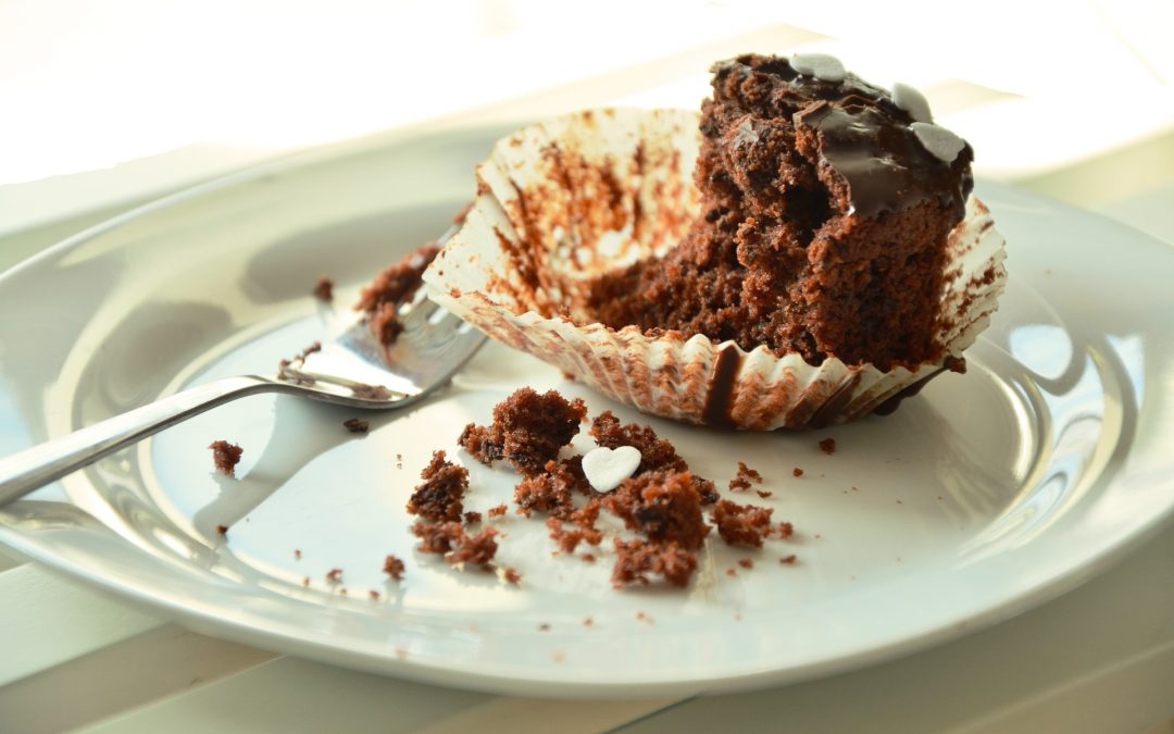 Partially eaten chocolate cupcake shows self-control